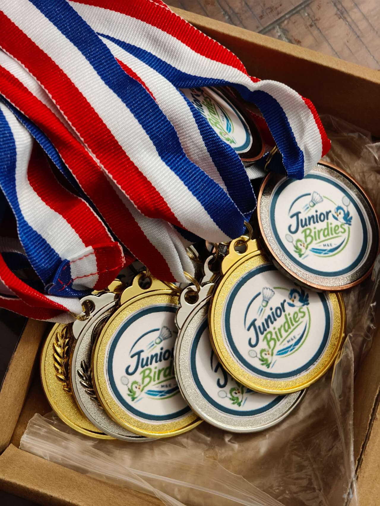 Medals from a Junior Birdies tournament